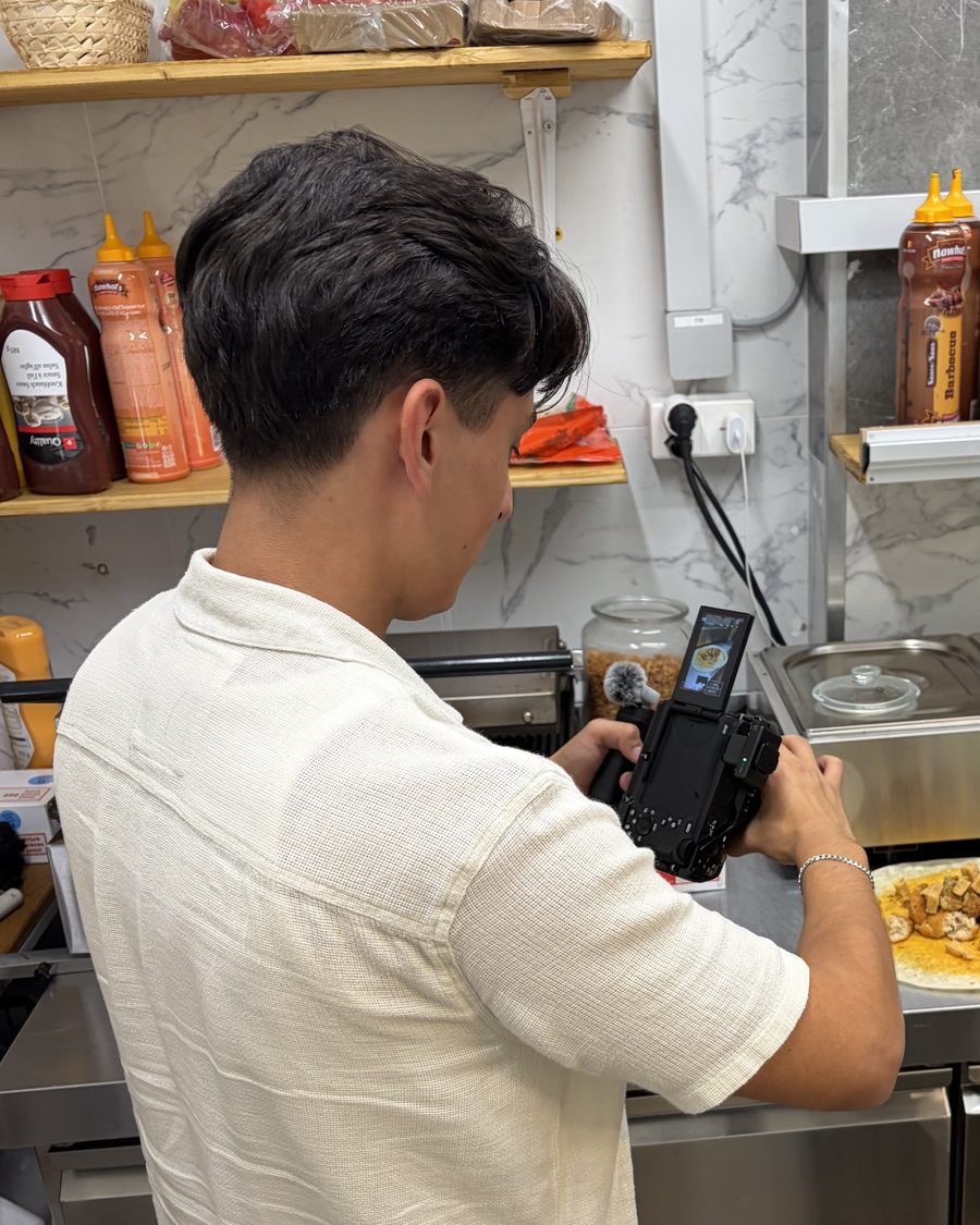 Kevin filming a food scene